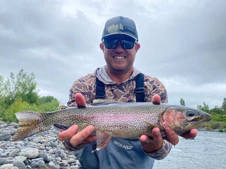 Angler with Tongariro River Trout